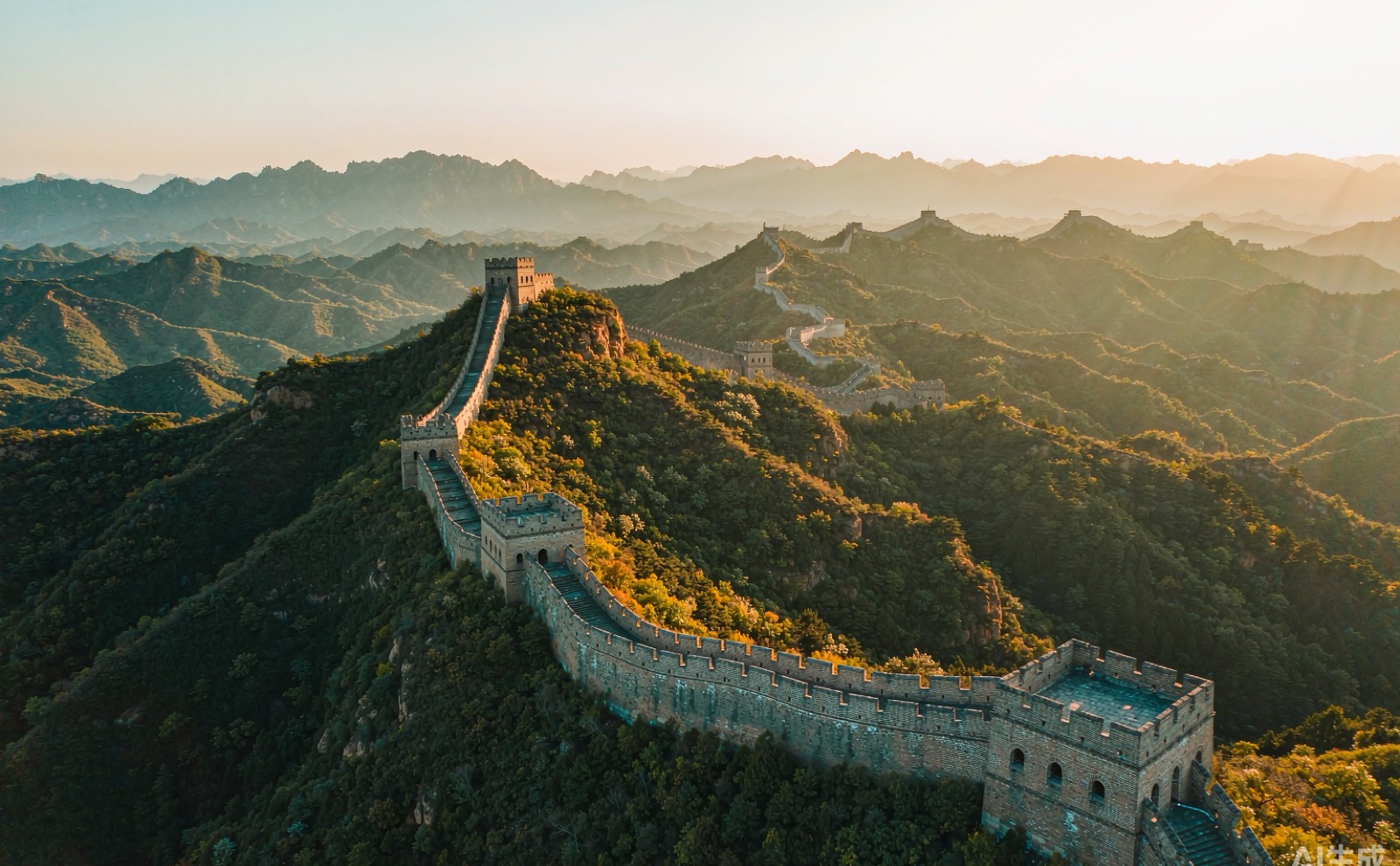 The Great Wall of China winding over green mountain ridges
