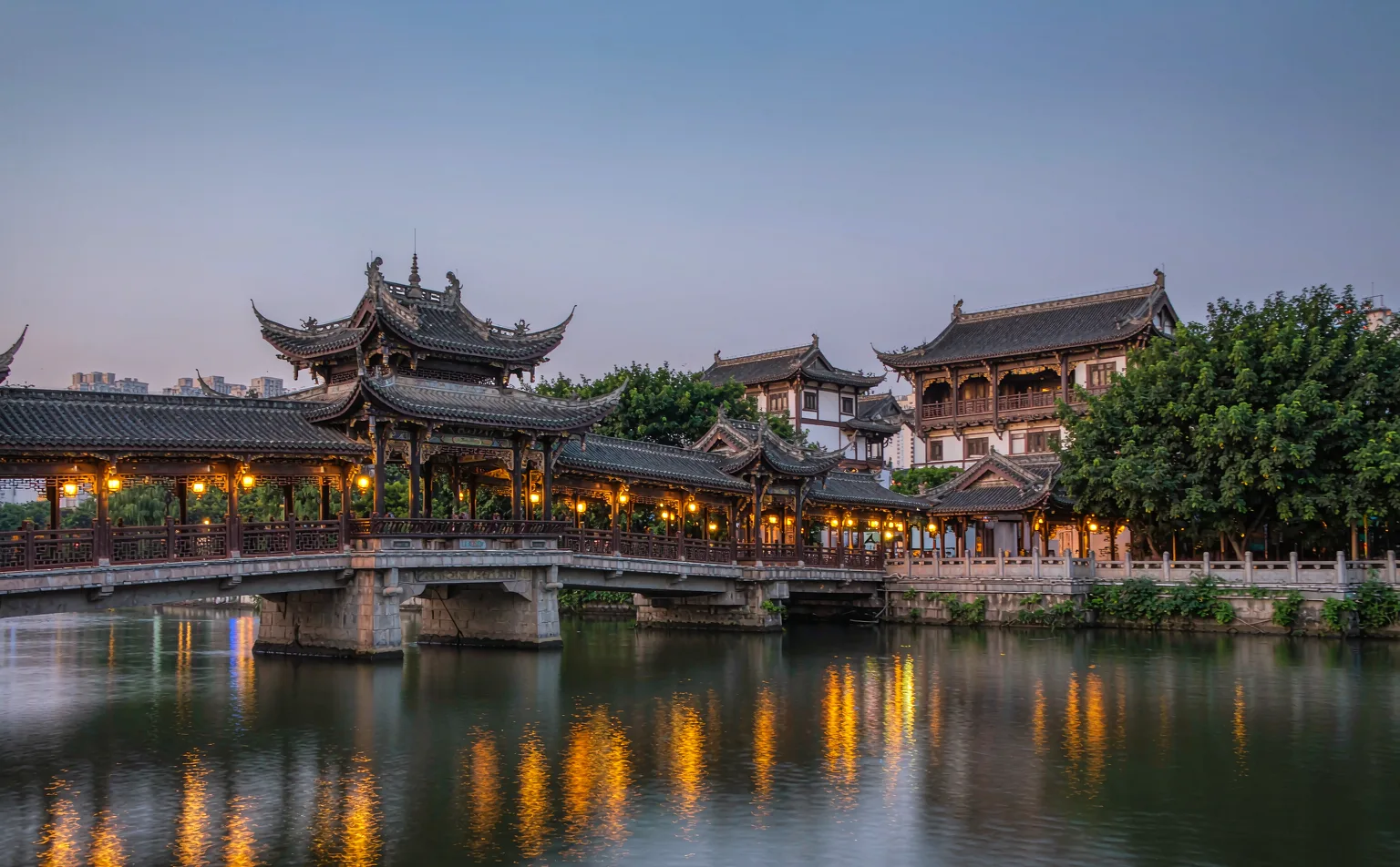 Anshun Bridge glowing at night over the Jin River in Chengdu
