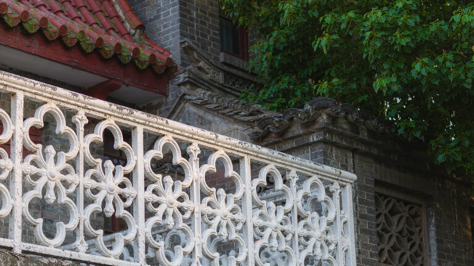 Ornate wrought-iron balcony detail on a Badaguan villa