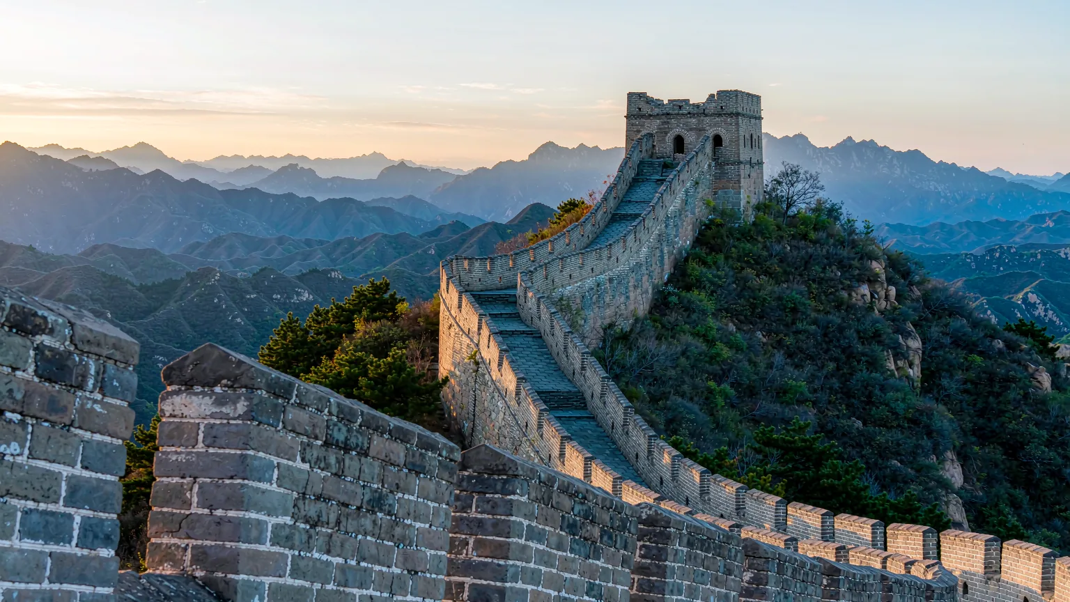 Badaling ramparts and watchtower climbing a ridge under clear morning sky