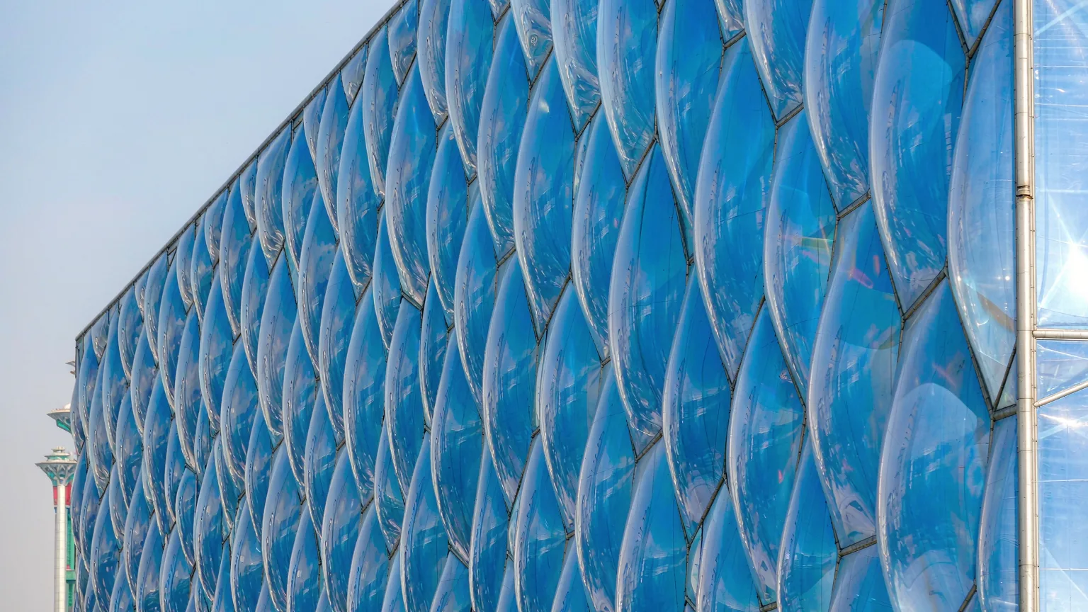 Close-up of Water Cube's blue bubble facade in sunlight