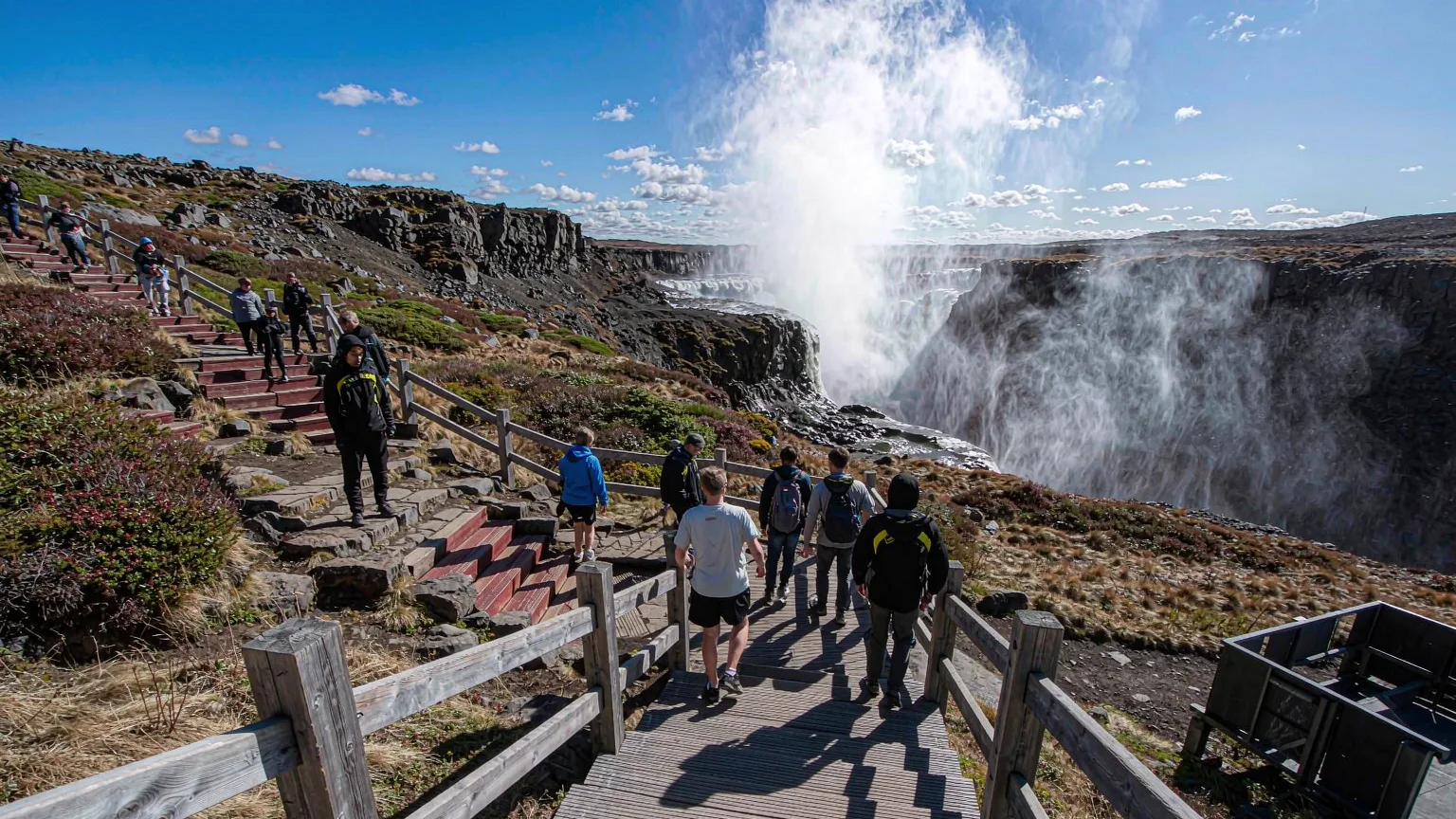 Visitors on wooden boardwalk approaching Changbai Waterfall viewing platform