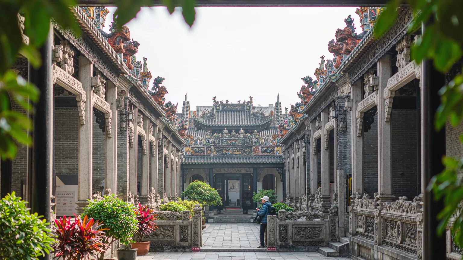 Central courtyard of Chen Clan Ancestral Hall with stone path and potted plants