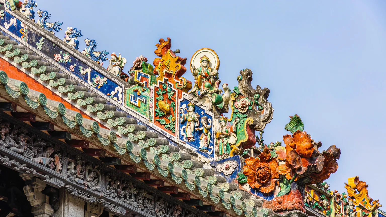 Intricate Shiwan ceramic figures on the roof ridge of Chen Clan Ancestral Hall