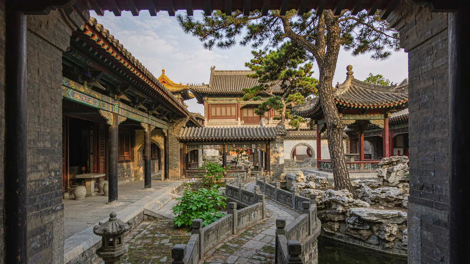 Interior courtyard of the Confucius Mansion with traditional halls and ancient trees