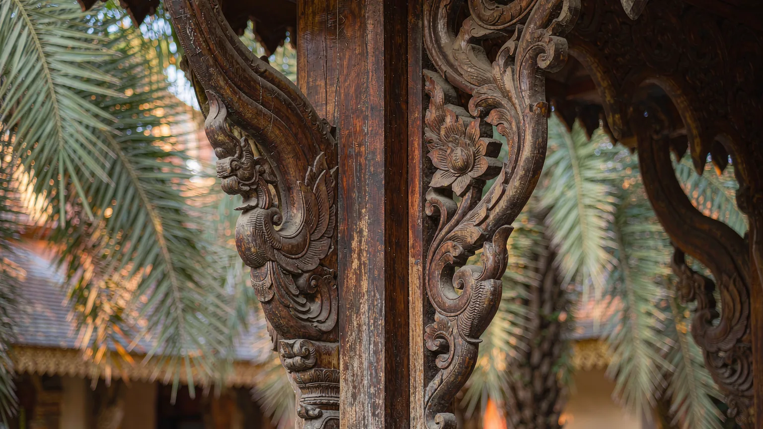 Intricate woodcarving detail on a Dai temple pillar in Dai Park