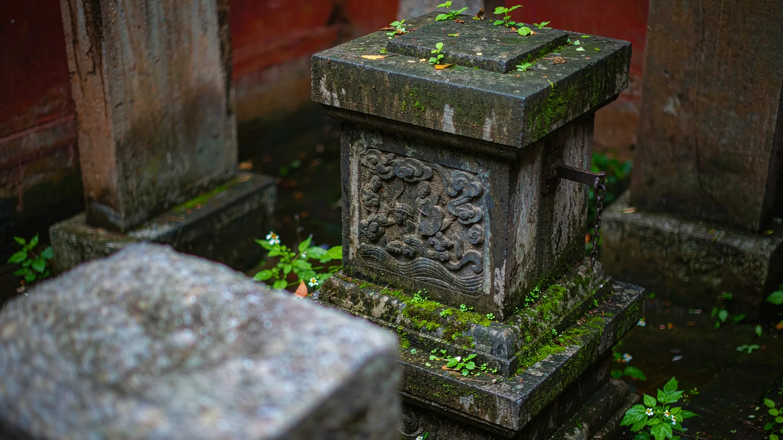 Close-up of ancient stone stele with carvings in Dai Temple