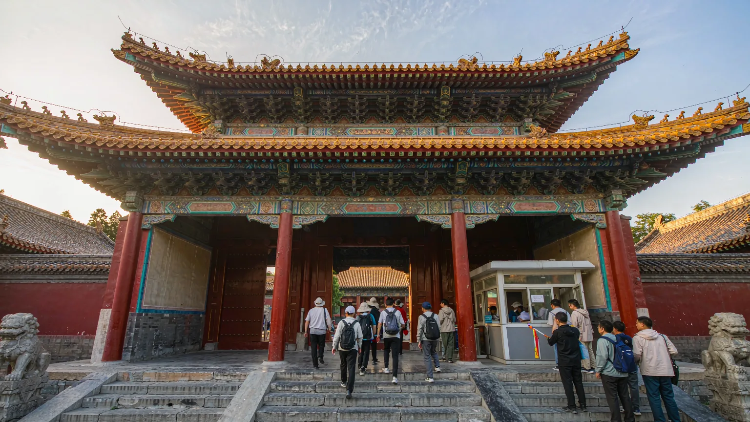 Visitors entering Dai Temple through the southern gate with tour guide