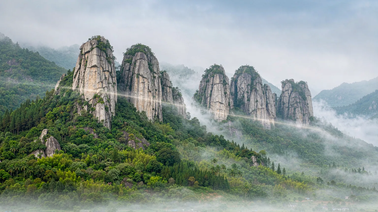 Granite peaks of Damingshan with mixed vegetation and mist