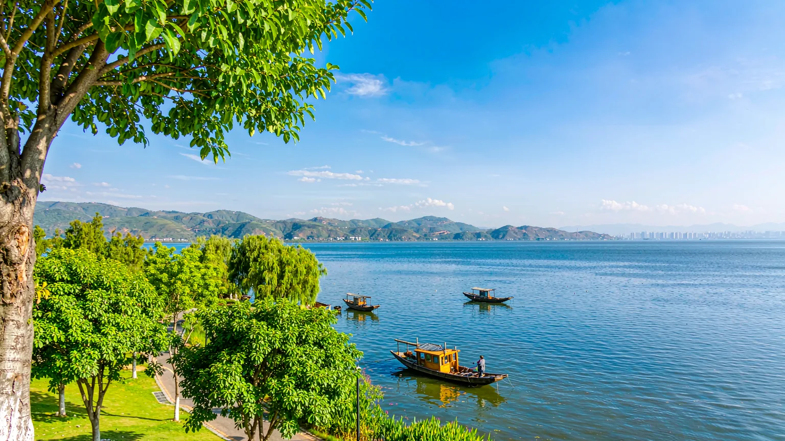 Panoramic view of Dianchi Lake with boats and wetlands