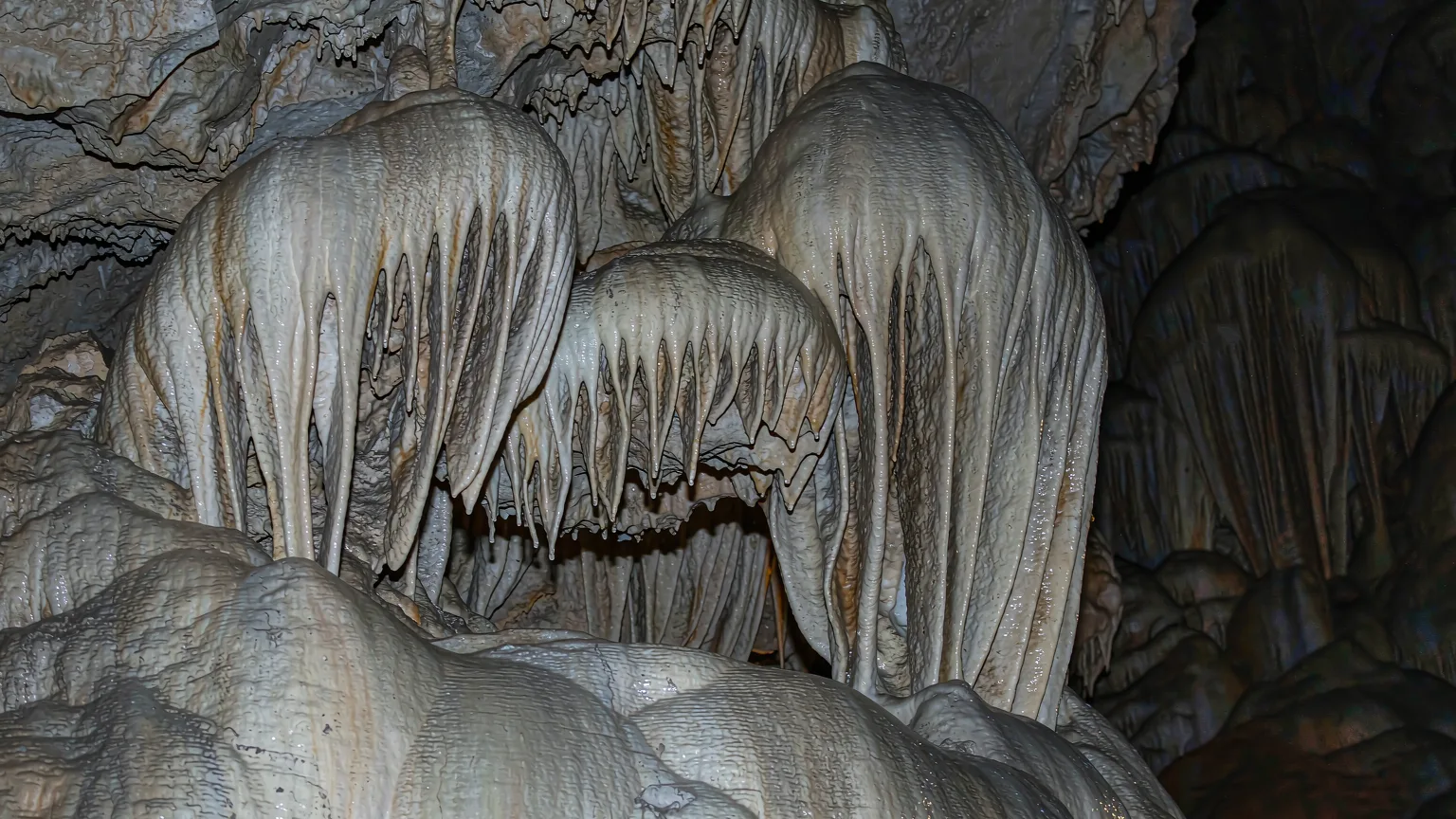 Detailed stalactite formations inside Dragon Palace cave