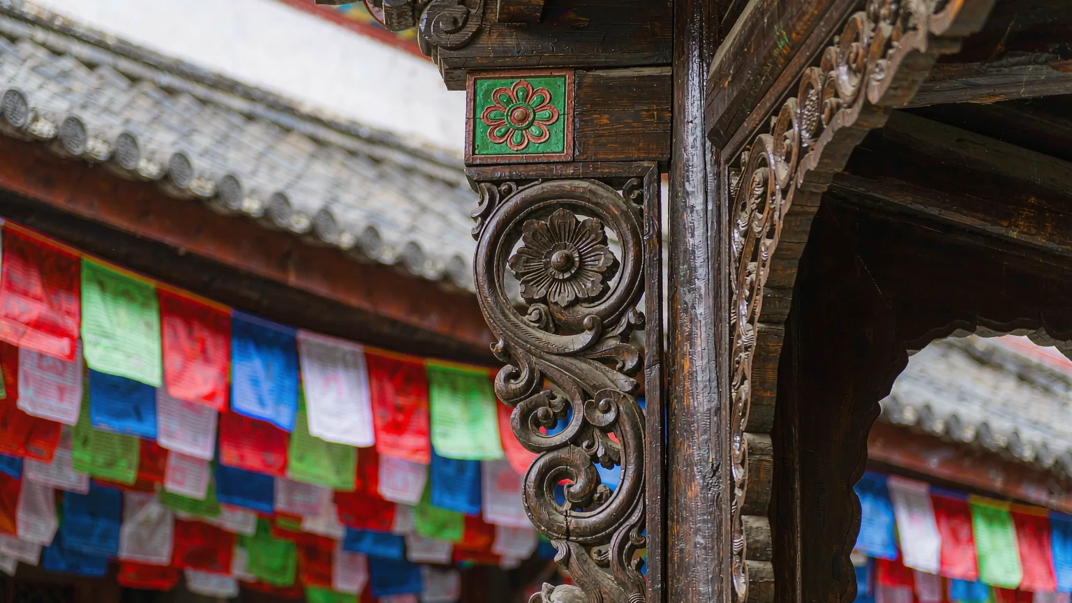 Intricate wood carvings on a traditional Tibetan house in Dukezong