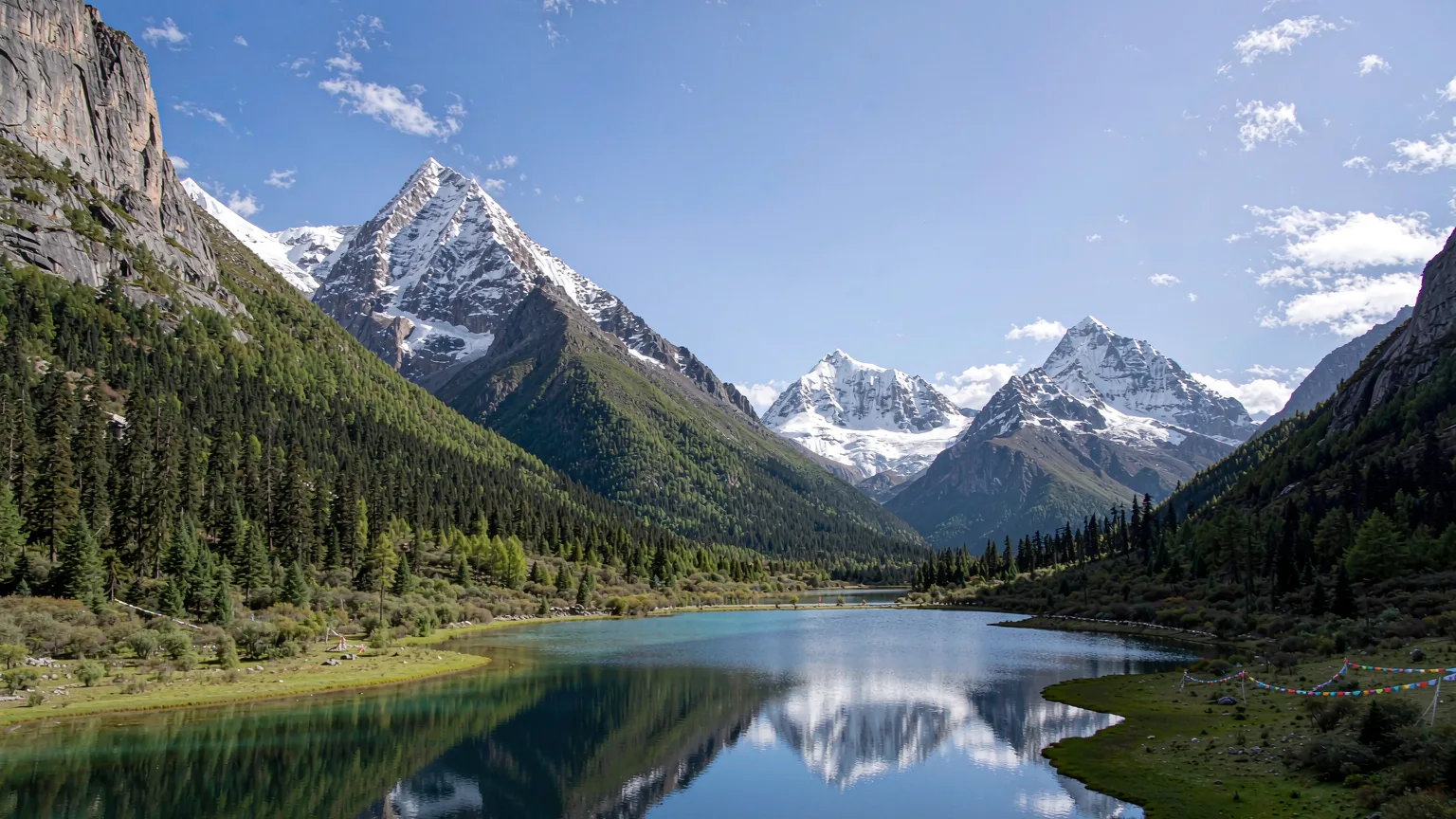 Five-Color Lake surrounded by three sacred snow peaks