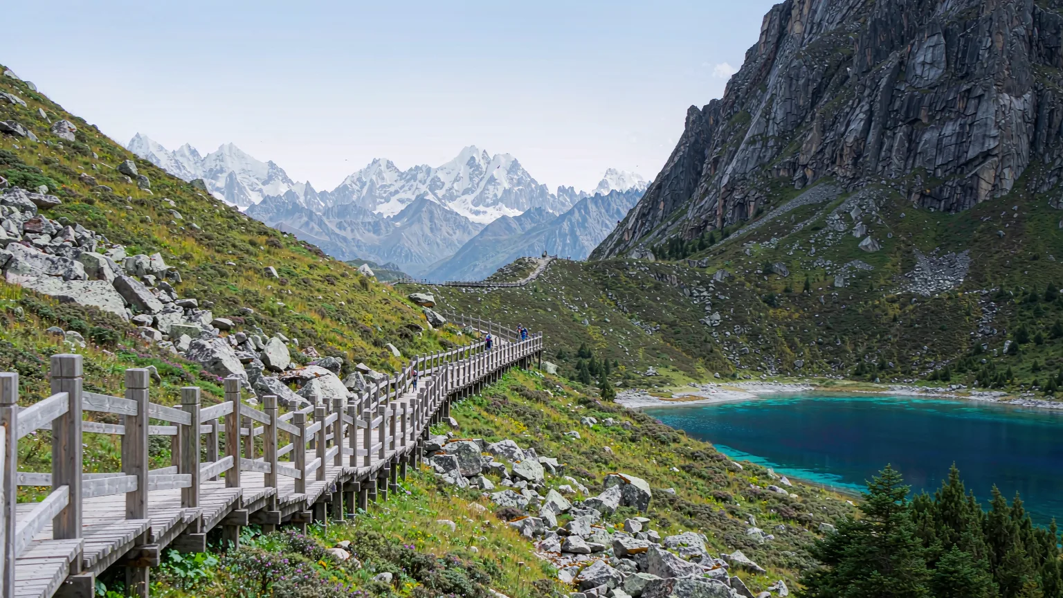 Hikers ascending steep wooden trail to Five-Color Lake