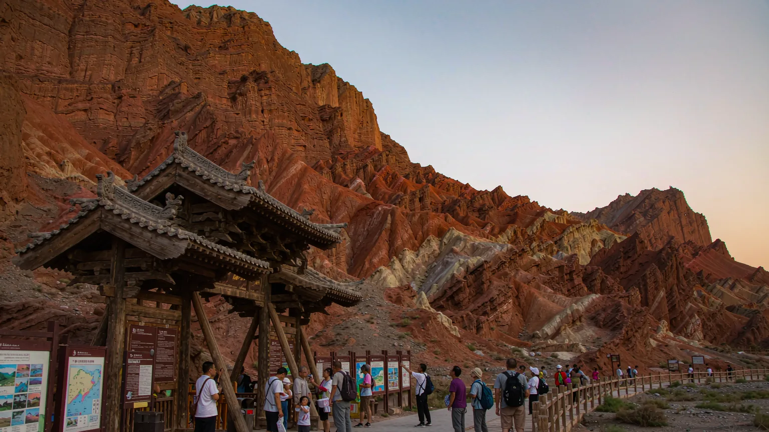 Tourists at the entrance pathway of Flaming Mountains with guide