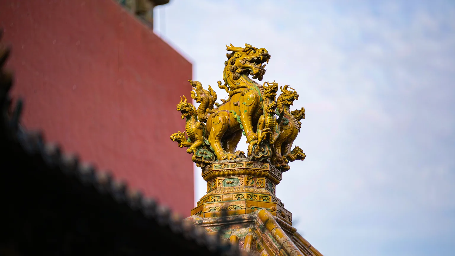 Detail of a glazed dragon roof ornament in the Forbidden City
