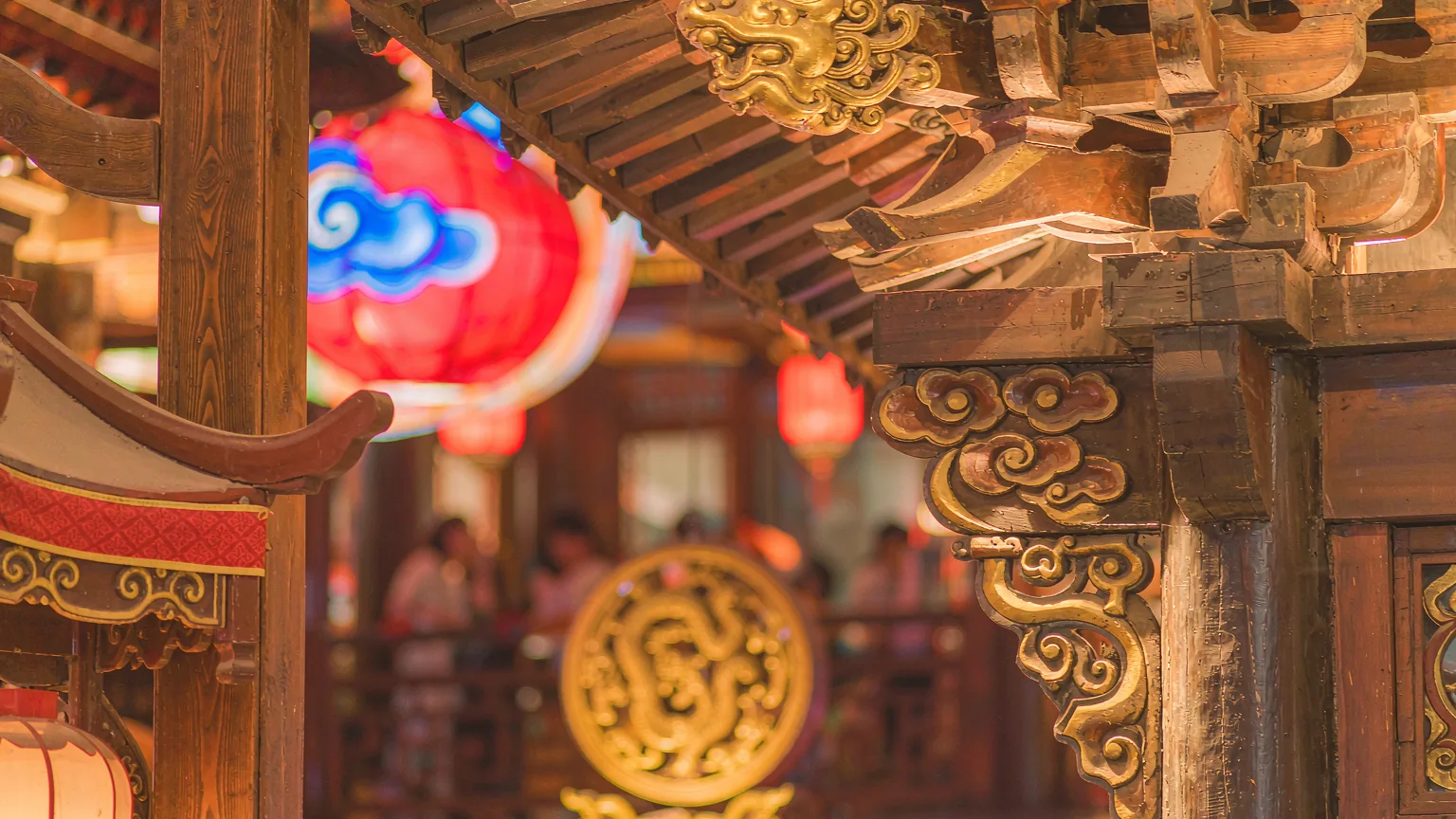 Intricate Tang-dynasty woodwork detail on Grand Tang Mall pavilion