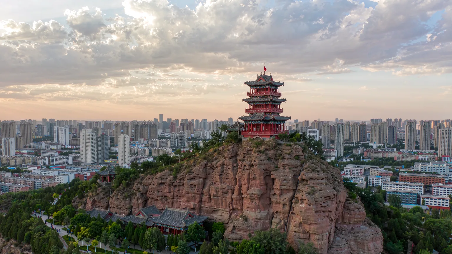 Red rock outcrop and pagoda at Hongshan Park in Urumqi