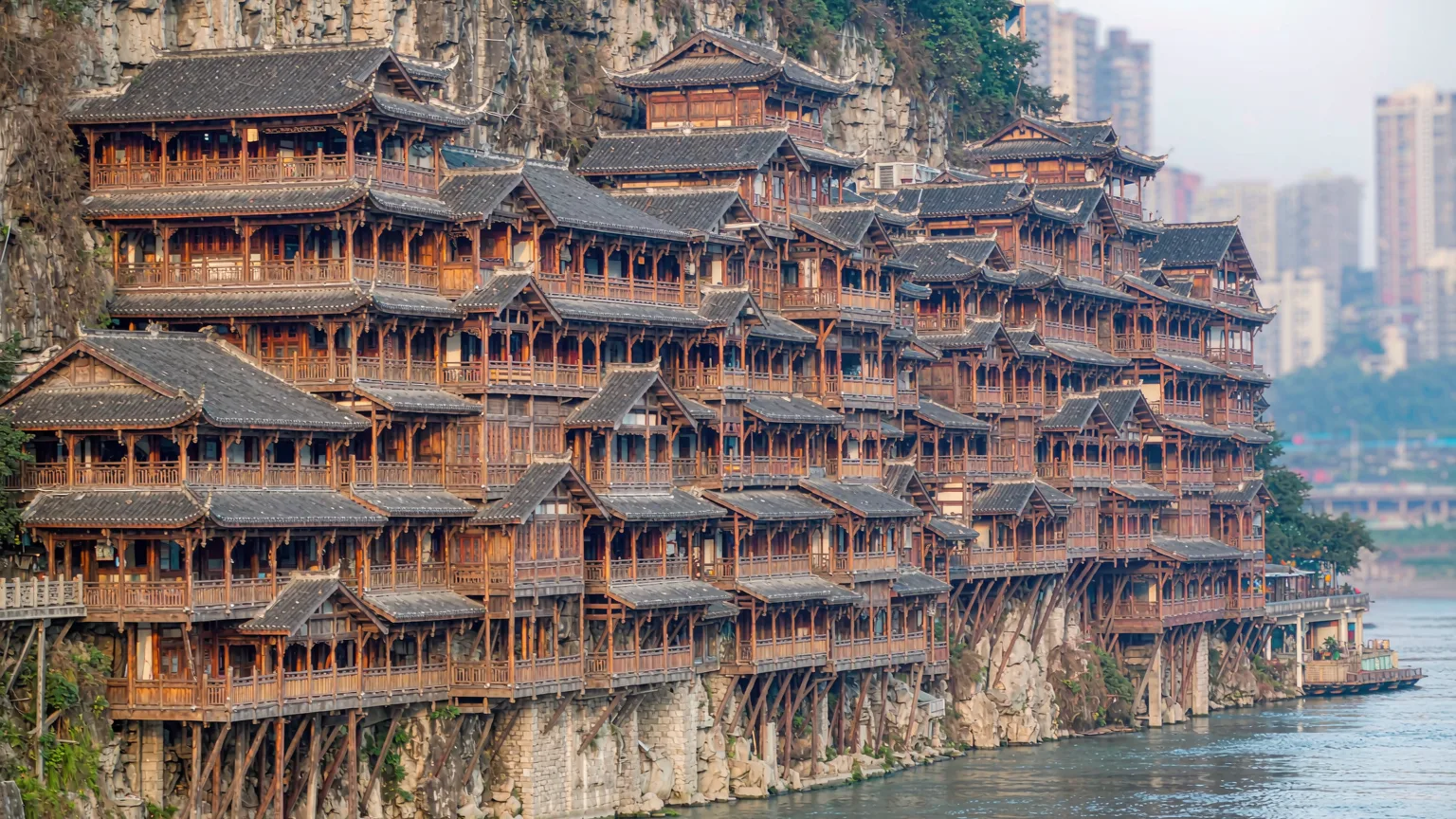 Multi-tiered wooden stilt houses of Hongya Cave stacked on a Chongqing cliff