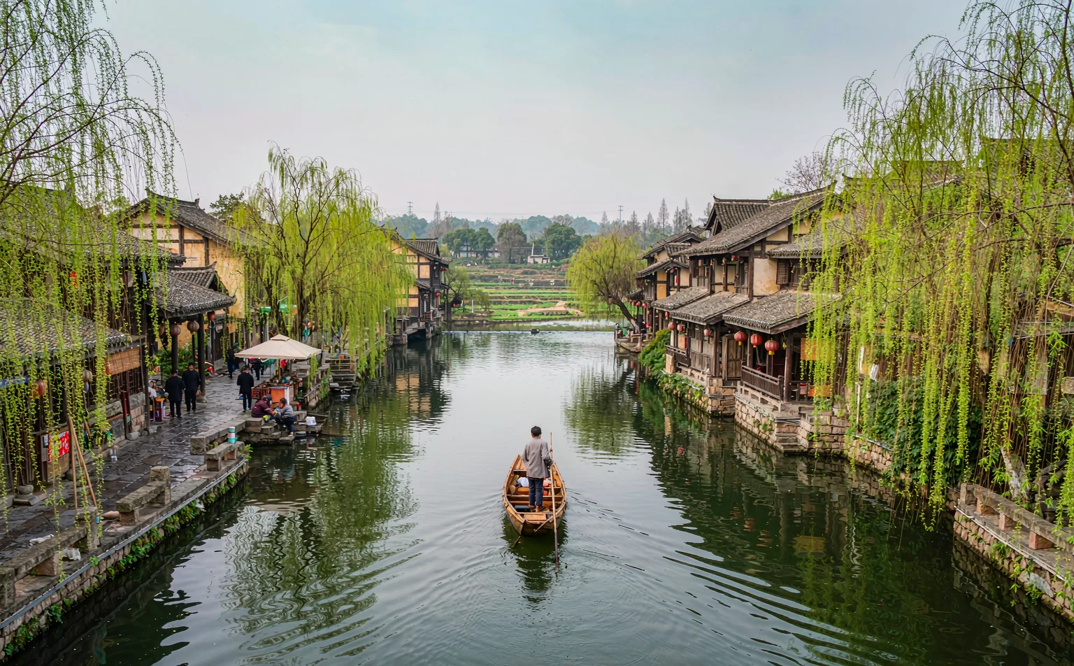 Boat drifting on the river beside Huanglongxi Ancient Town