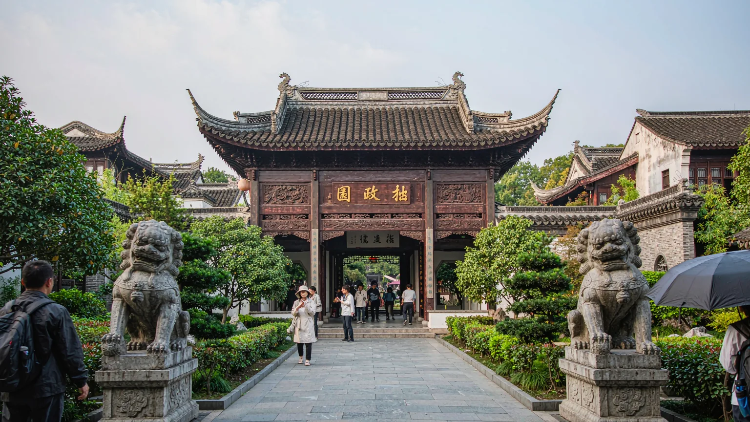 Tourists entering the main gate of Humble Administrator's Garden in Suzhou.