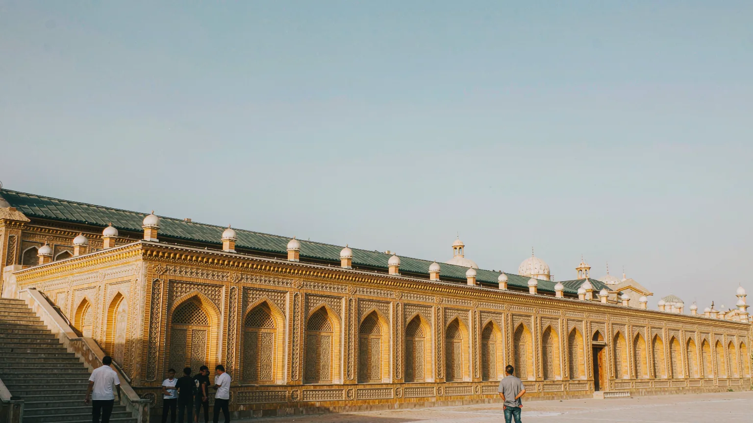 Wide view of Id Kah Mosque's sprawling yellow-tiled complex in Kashgar