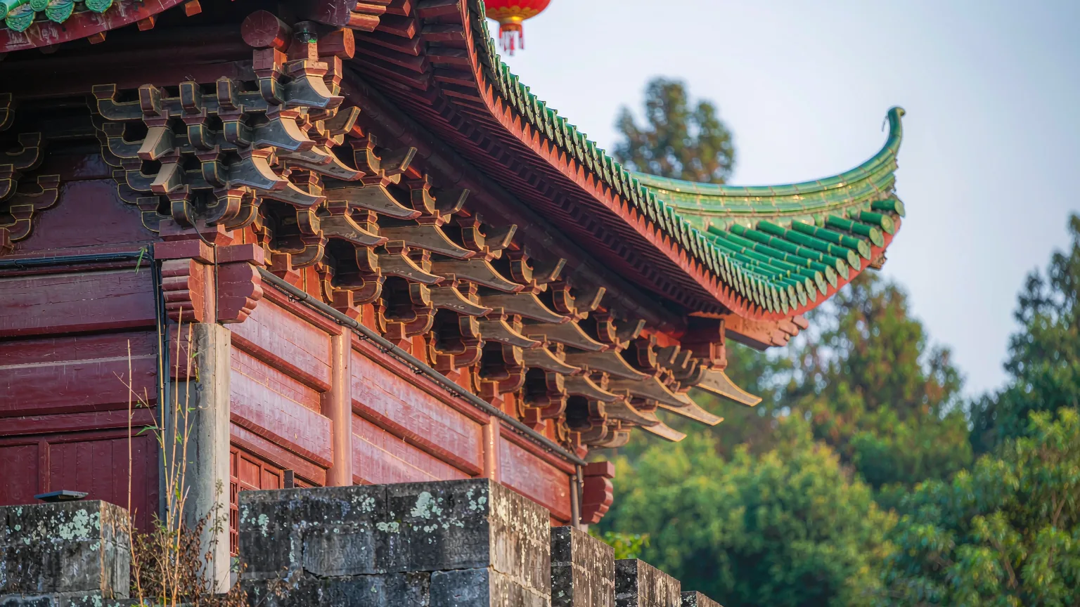 Intricate carved eaves and green roof tiles of Jiaxiu Tower in Guiyang