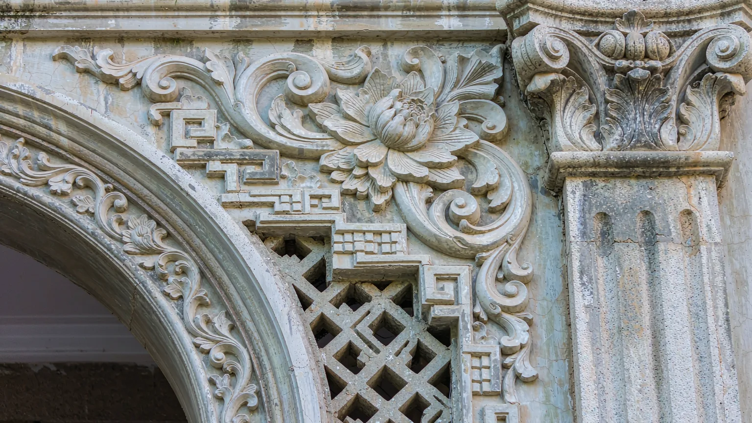Close-up of intricate stone carving on Jimei School Village building