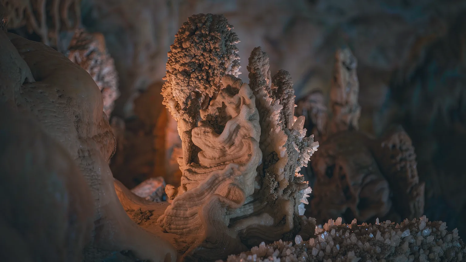 Close-up of glistening stalactites in Jiuxiang cave