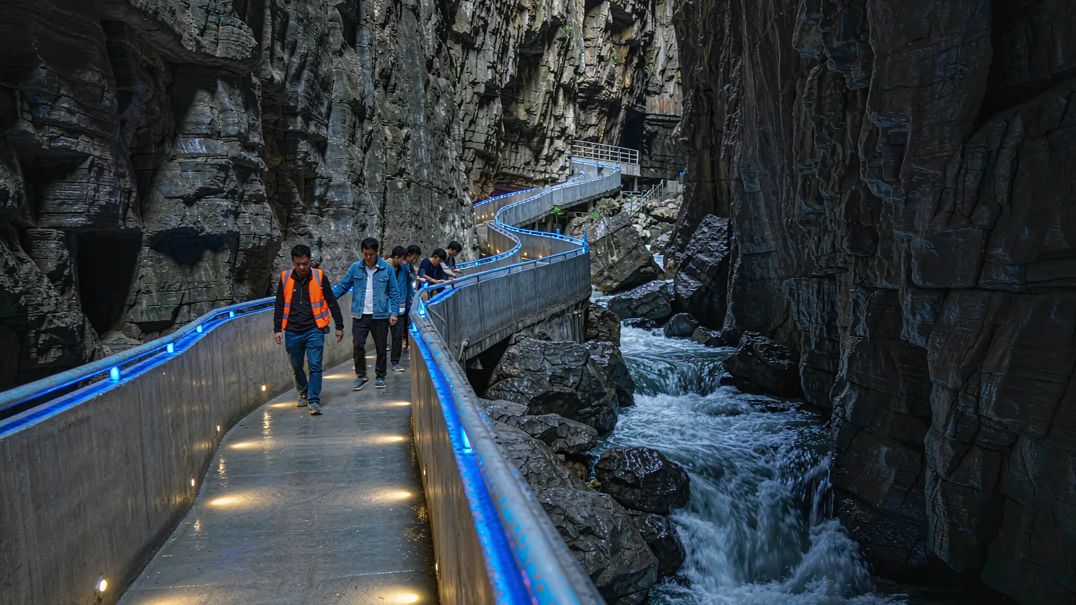 Tourists on a pathway inside Yinxiu Gorge at Jiuxiang