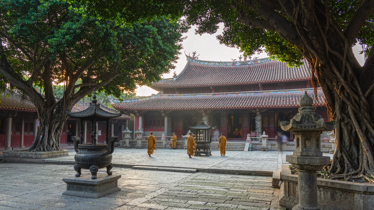 Serene courtyard of Kaiyuan Temple with ancient banyans and Hall of Mahavira