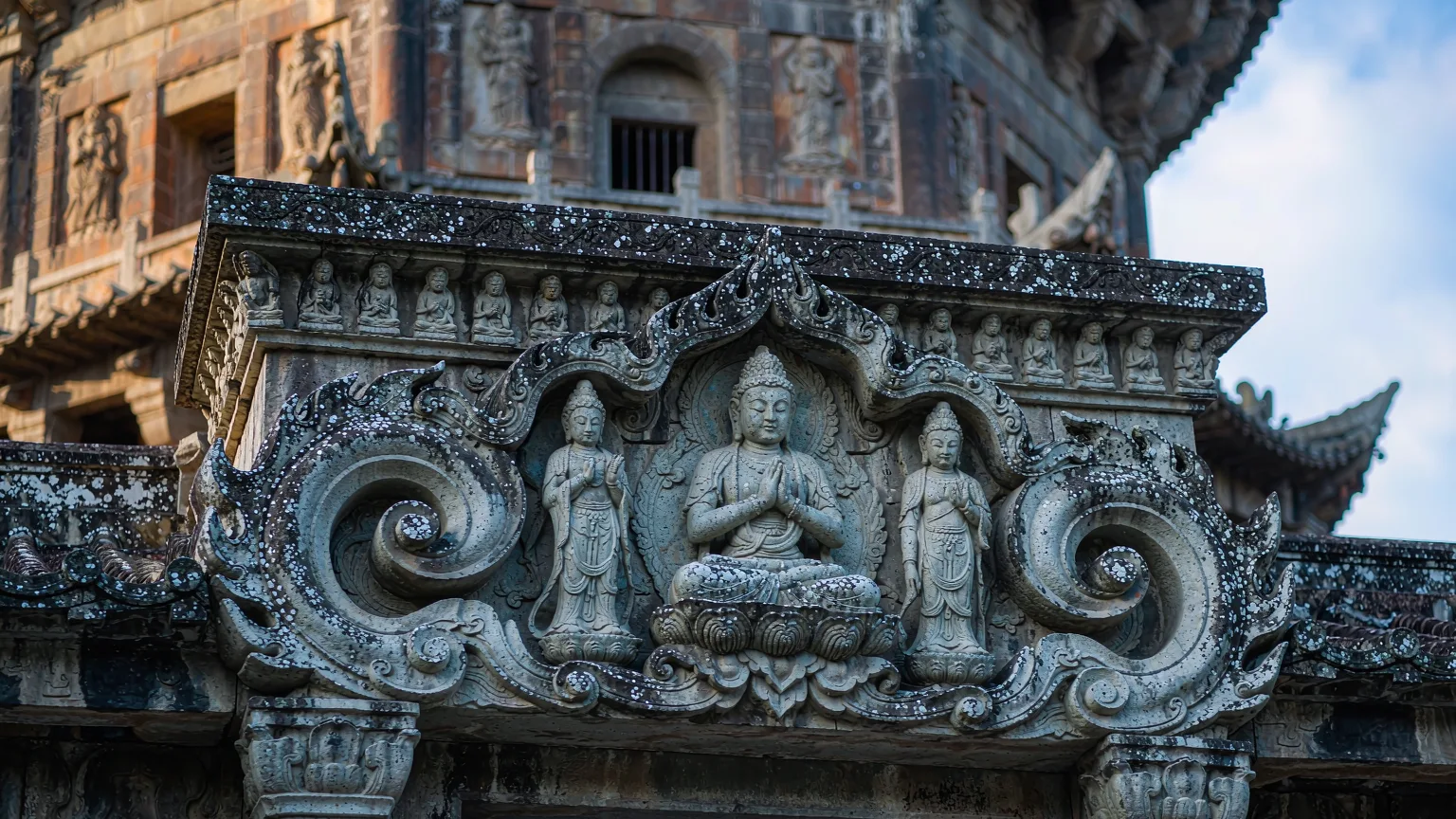 Close-up of intricate Buddhist stone carvings on Kaiyuan Temple's East Pagoda