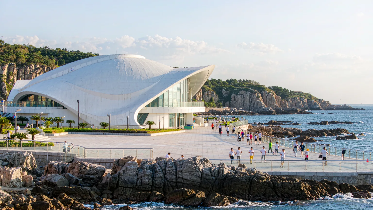 White domed Polar Hall overlooking the rocky Yellow Sea coast at Laohutan