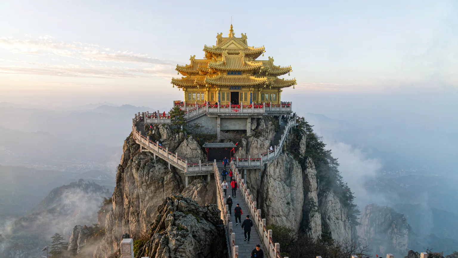 Golden Hall Temple complex on Laojun Mountain summit with misty peaks