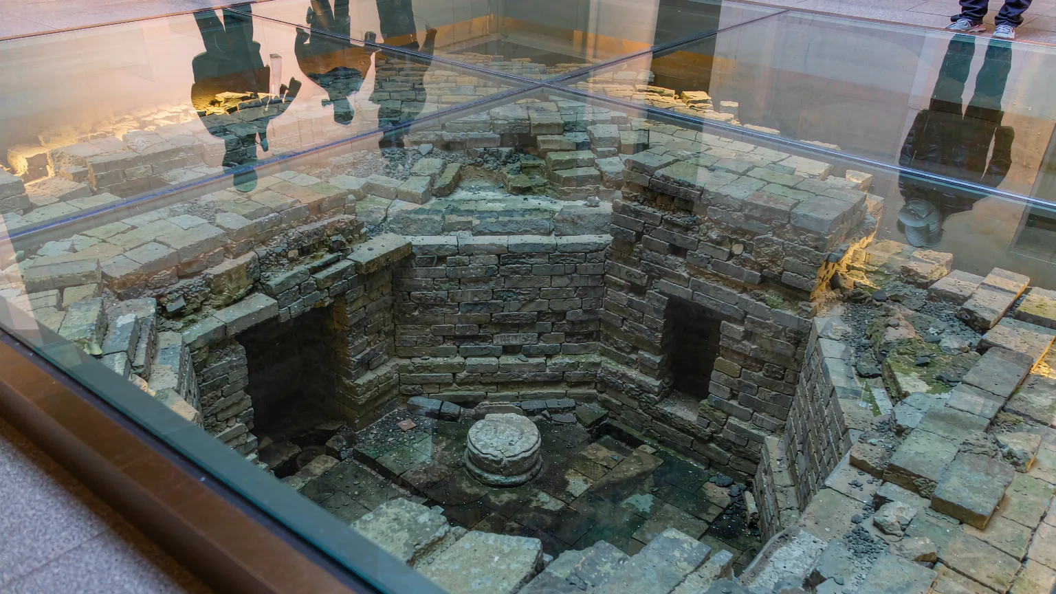 Original brick ruins of Leifeng Pagoda preserved under glass flooring