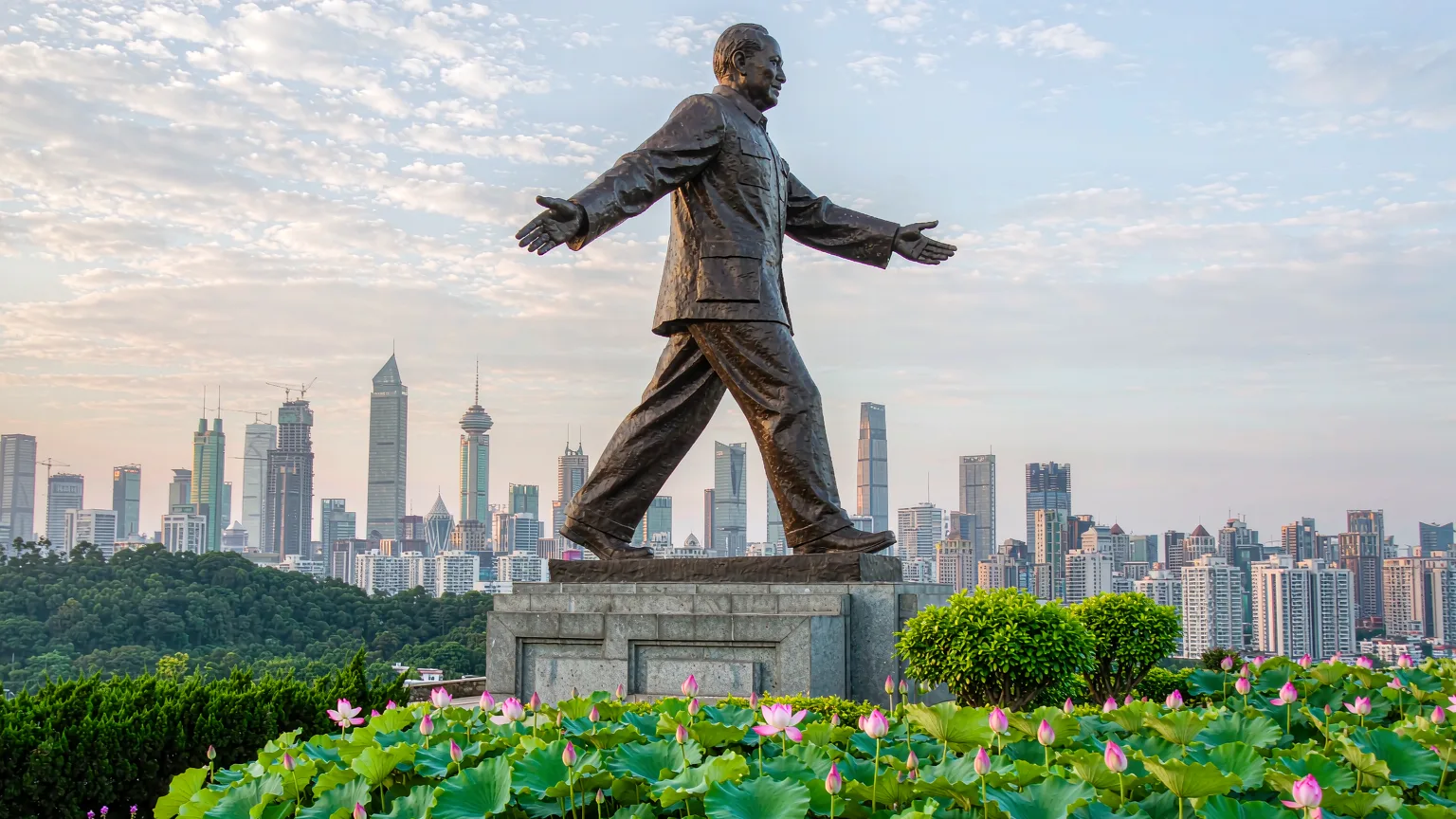 Deng Xiaoping statue at Lianhuashan Park summit with CBD backdrop