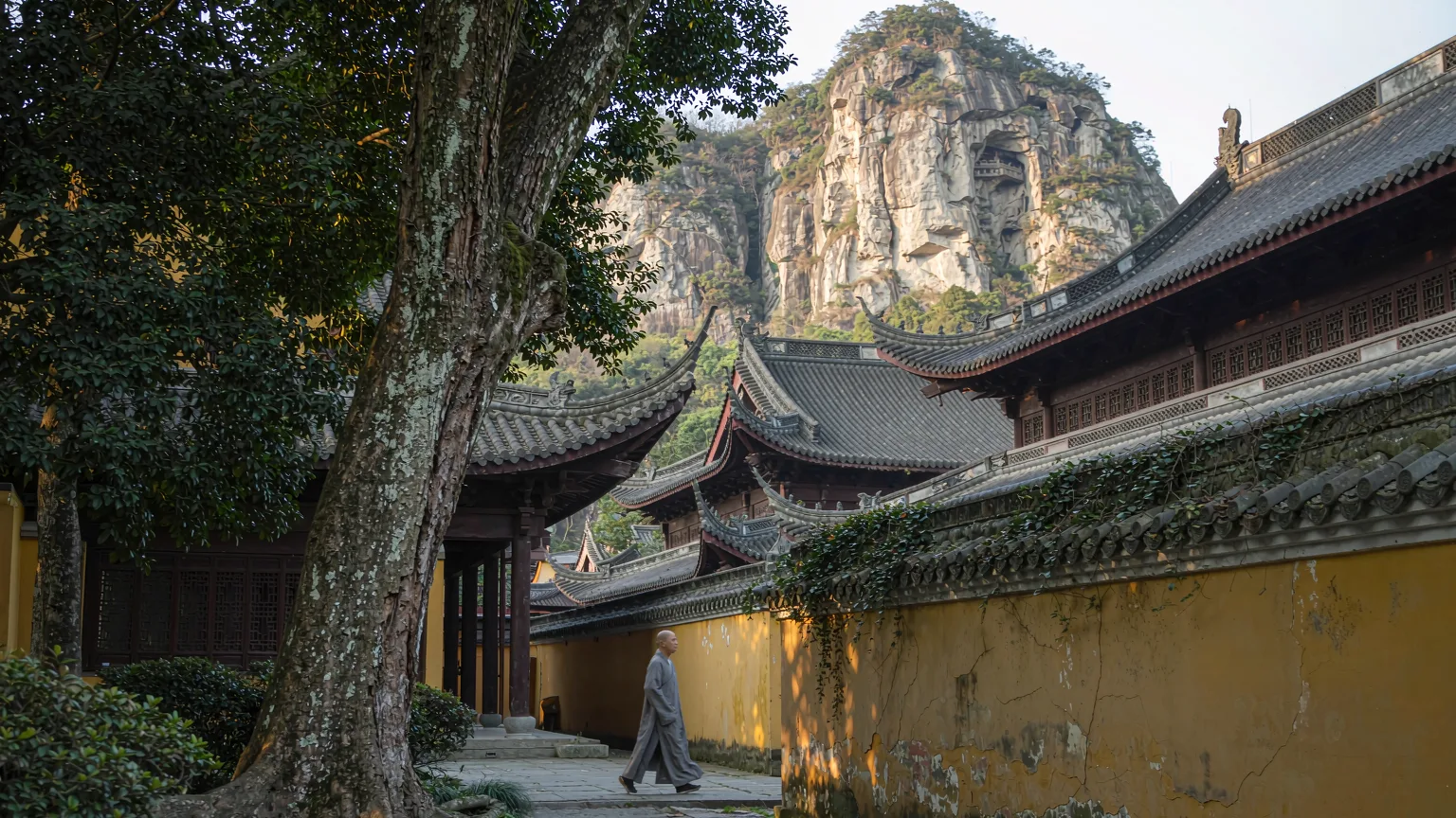 Lingyin Temple halls with ancient trees and Feilai Feng
