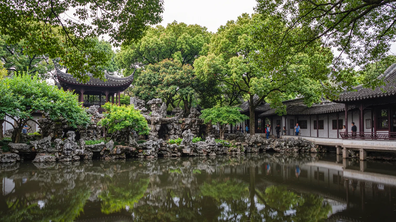 Classical Chinese garden scene with limestone rockery and pond at Lion Grove Garden