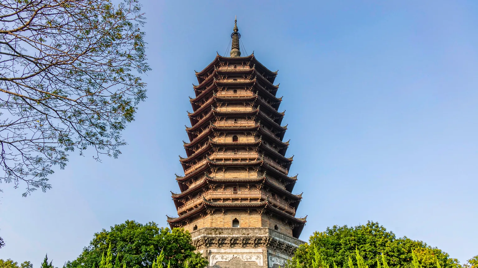 Octagonal Liuhe Pagoda with thirteen eaves amid trees