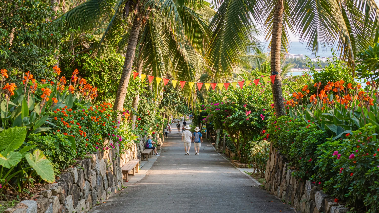 Tourists ascending the scenic path to Luhuitou Park summit in Sanya