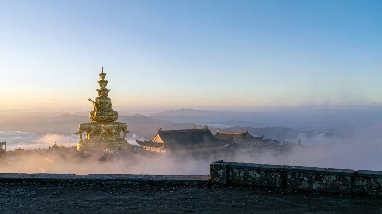 Mount Emei golden summit at sunrise with the gilded Samantabhadra statue