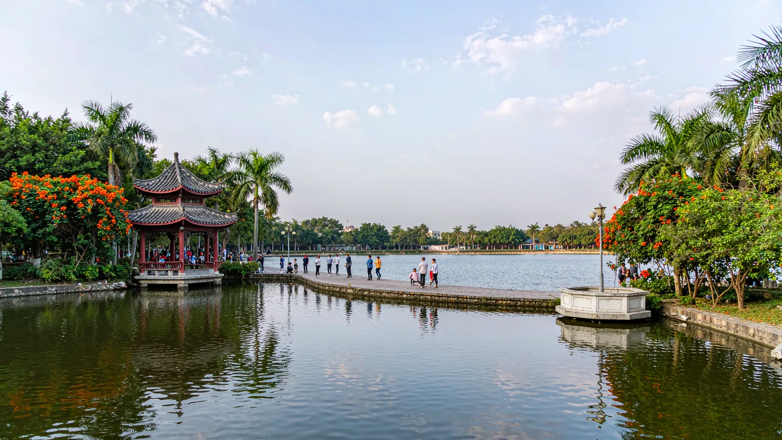 Nanhu Park lake with pavilion and strolling locals