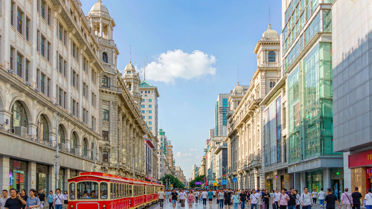 Daytime scene of Nanjing Road Pedestrian Street with historic department stores and shoppers