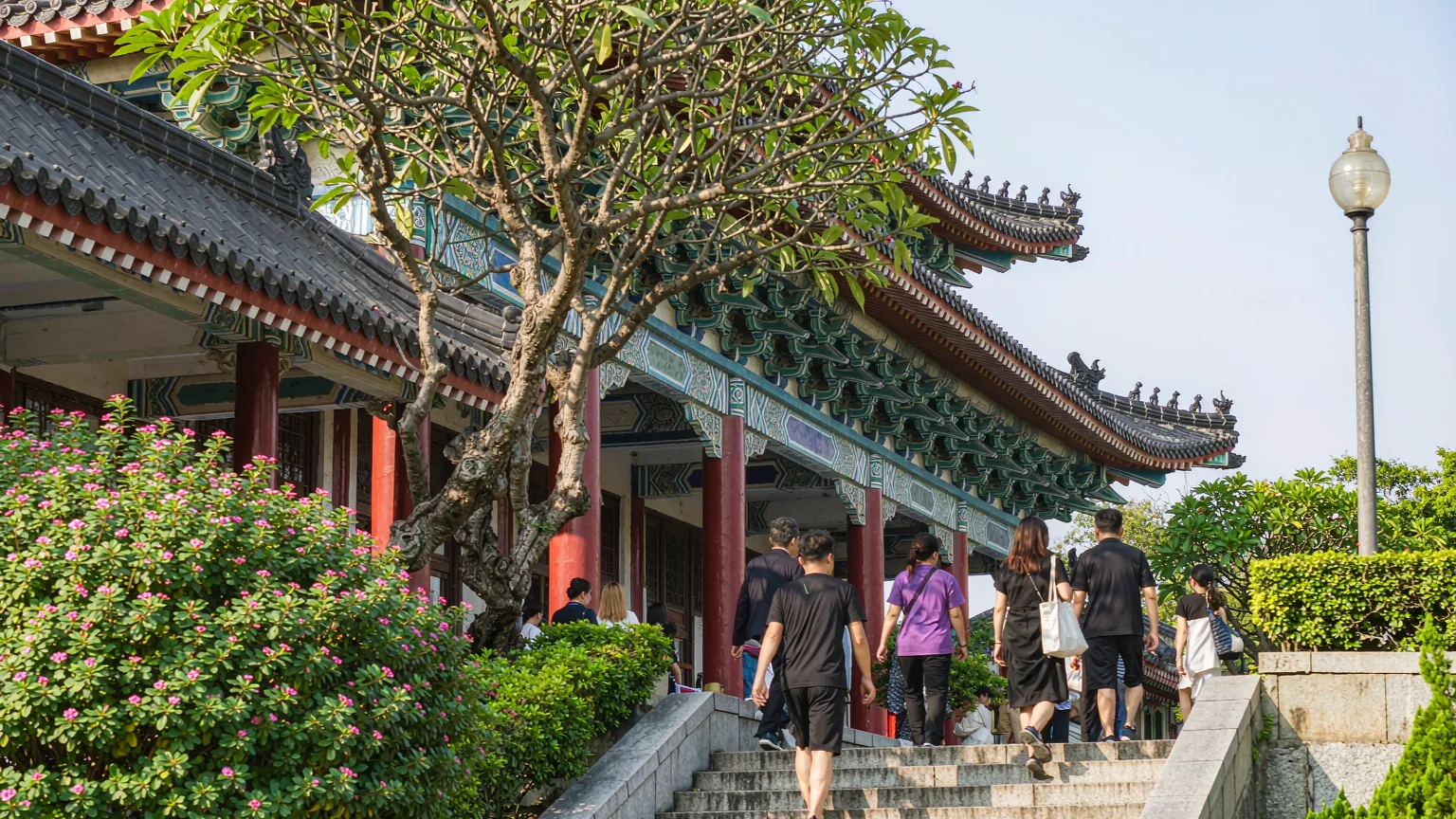 Grand staircase and entrance of National Palace Museum with visitors walking up