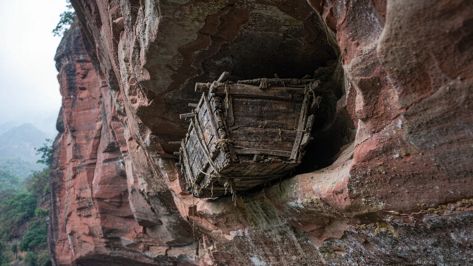 Ancient hanging coffin in a cliff cave above Nine-Bend Stream