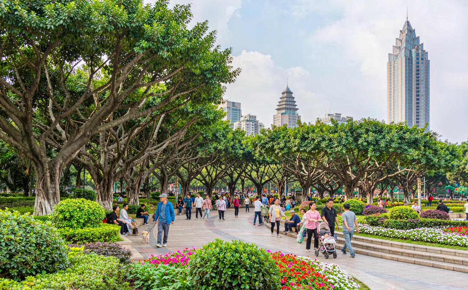Flower beds and shaded walkways at the entrance of People's Park