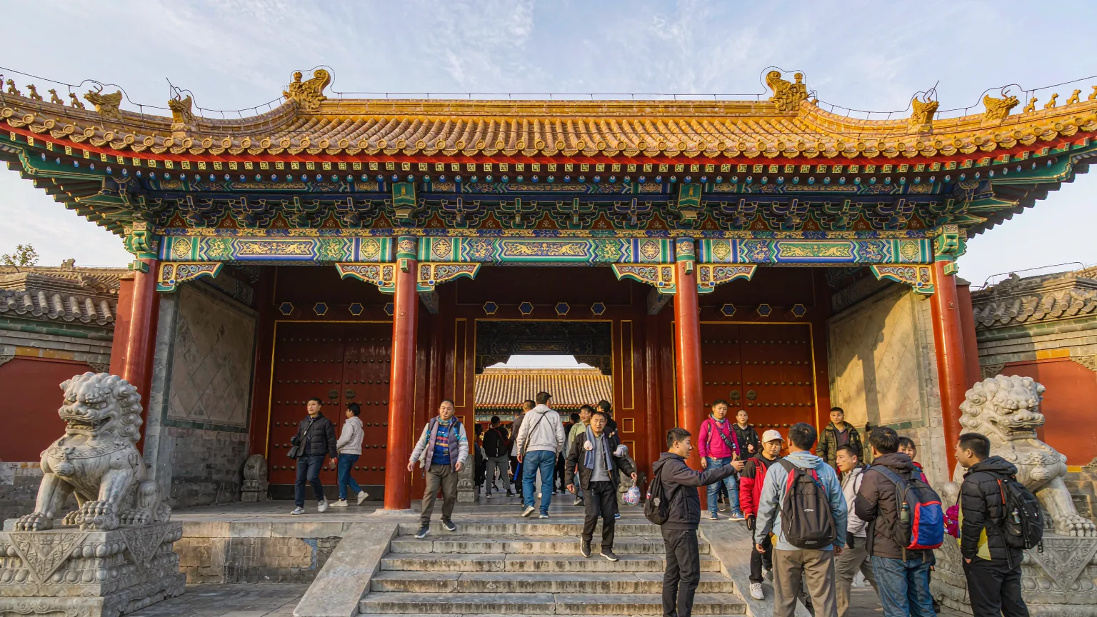 Tourists entering Prince Gong's Mansion with a guide