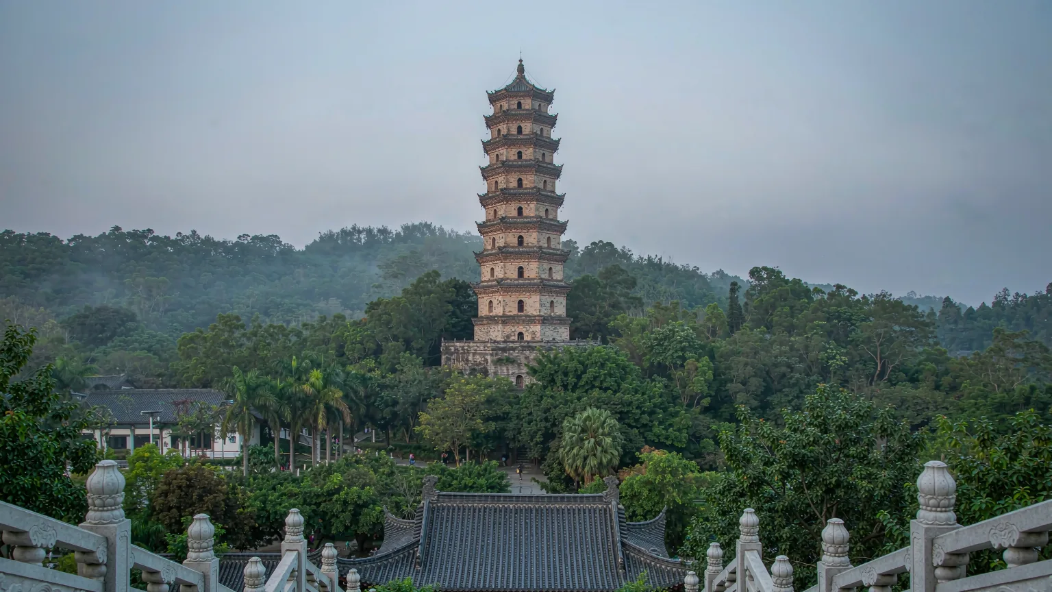 Nine-story Longxiang Pagoda on Qingxiu Mountain surrounded by lush subtropical forest