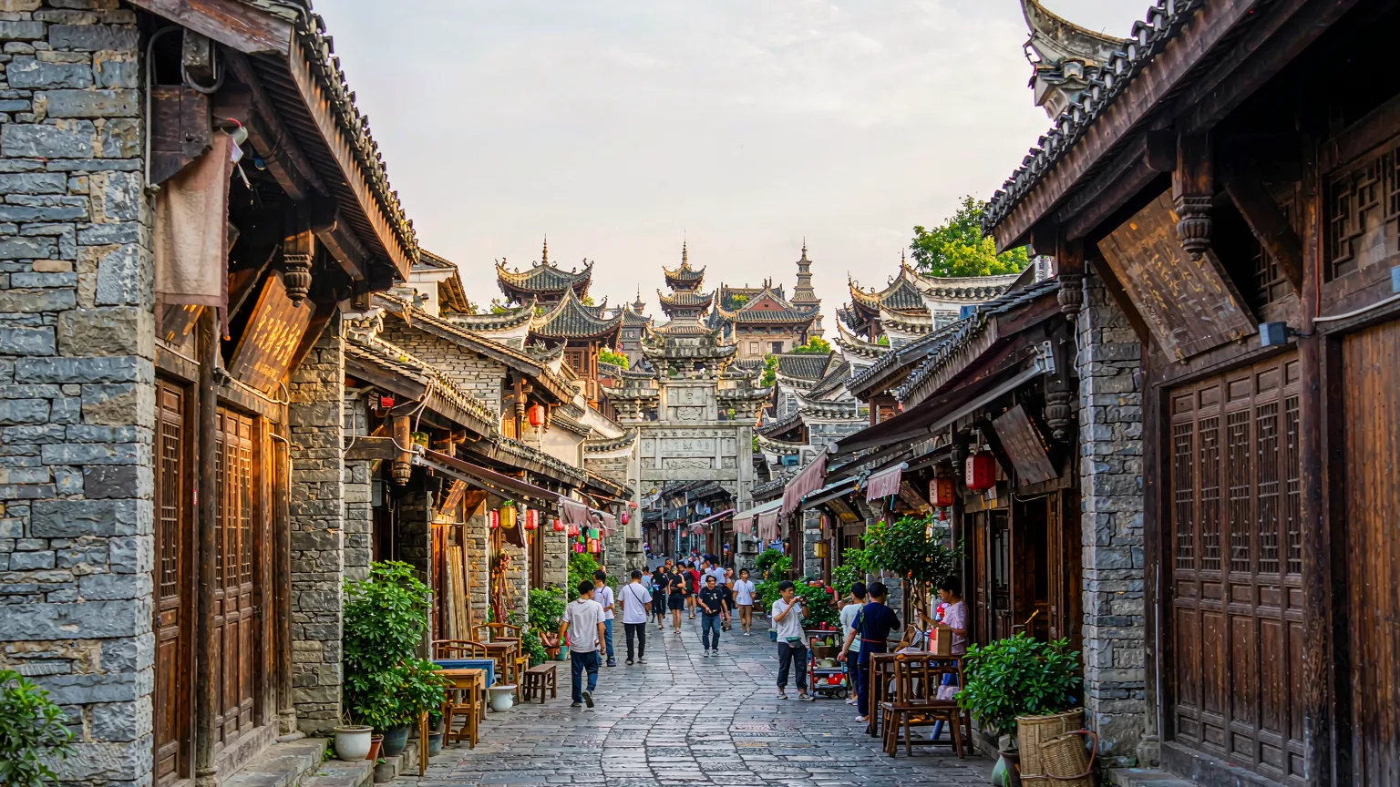 Stone street in Qingyan Ancient Town with traditional architecture and people