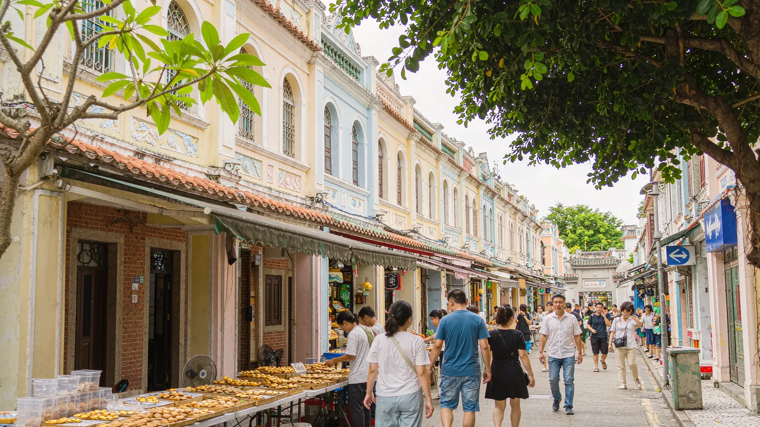 Pedestrian street Rua do Cunha with Portuguese architecture and food stalls in Macau